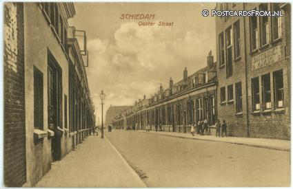 ansichtkaart: Schiedam, Ooster Straat. Banketfabriek M.J. Vlug